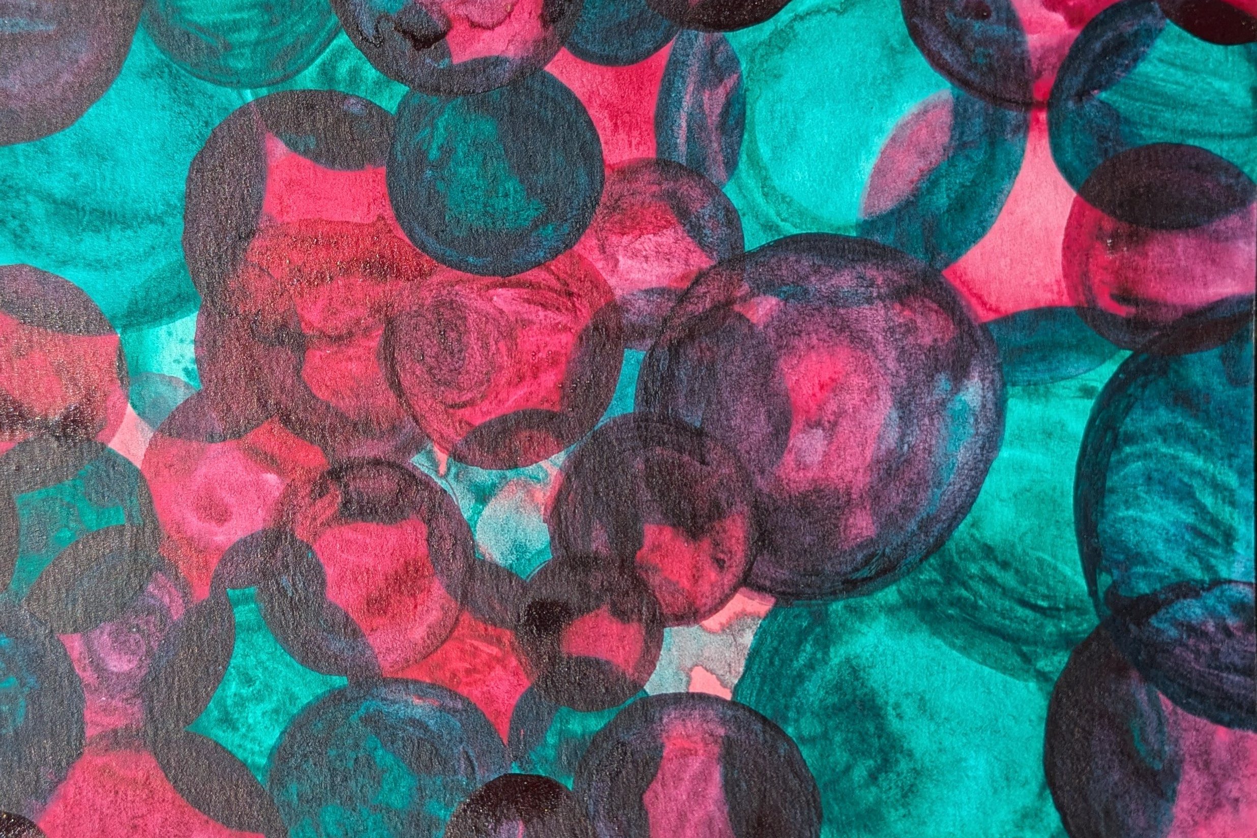 Circles overlapping in teal and magenta